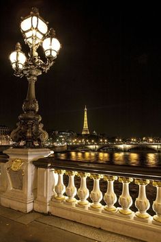 a street light with the eiffel tower in the background