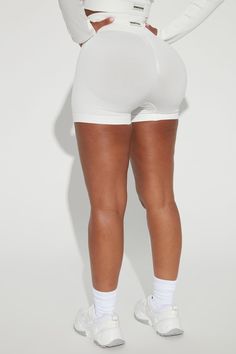 Available In White. High Waist Performance Shorts Wide Waistband For Comfort And Support All Over Textured Rib Weave Body Hugging Fit Seamless Ribbed Knit Fabric Ruched Detail At Back 92% Nylon 8% Elastane Imported | Effortless Nix Ribbed Seamless Hot Short in White size Large by Fashion Nova Search By Photo, Hot Short, Sweater Jumpsuit, Free Dresses, Wide Waistband, Matching Dresses, White Fashion, Fashion Nova, White Shorts