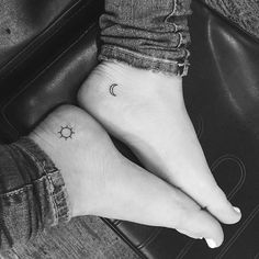 two small sun and moon tattoos on the feet