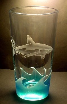 a glass with an image of a dolphin on it