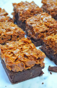 there are brownies with caramel frosting on top of each one, cut into squares