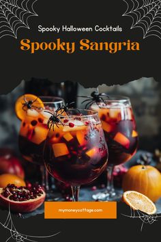 spooky halloween cocktails with orange slices and pomegranate in glasses