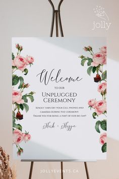 a welcome sign with pink roses on it and the words welcome to our unplugged ceremony