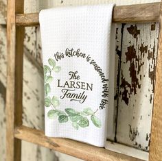 a kitchen towel hanging on a wooden rack