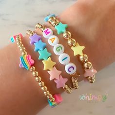 Personalized Bracelet Stack | Create your own stack | Stars | Rainbow | Gold This adorable pastel rainbow star bracelet stack is handmade with love by a momma to two little girls! Wear these bracelets individually, or wear the whole stack! They are fun to mix and match. I hope you enjoy this fun and sweet little accessory.  Create and personalize your own stack with this listing. The wording can be personalized to say whatever you would like. ❤ HELPFUL TIPS ❤  ❤ If you are local, I'll refund shi Look Bracelet Ideas, Star Beads Bracelet, Bead Bracelet Words Ideas, Preppy Bracelet Stack, Cute Diy Bracelets, Bracelet Sayings, Small Beaded Bracelets, Star Bead Bracelet