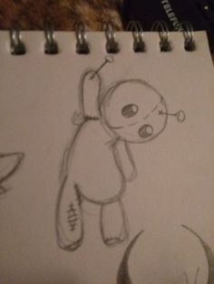 a drawing of a teddy bear on a piece of paper