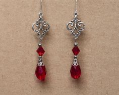 These elegant earrings are made from crystal beads and antique silver filigree. Available in black, red and amethyst. They will make a beautiful accessory for someone who loves Victorian or vintage style accessories. -Made from teardrop and bicone shaped beads, attached to rnate antique silver filigree -The earrings are 2 inches long, without the lever back closure -They have a lever back closure -Available in 3 colors: Black, Amethyst and Red, please select your preferred color from the drop do Vampiric Jewelry, Aretes Aesthetic, Silver Earrings Aesthetic, Vampire Book, Crystal Bead Earrings, Coquette Dark, Victorian Style Jewelry, Victorian Earrings, Black Amethyst