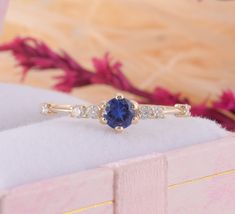 14k yellow gold blue sapphire promise ring for her, Unique dainty & elegant womens promise ring, Womens sapphire gold ring, Blue stone ring WE OFFER UNLIMITED PERIOD INSTALLMENTS PLAN This is a beautiful, stunning, feminine ring that works well for all occasions, styles, and ages. You will love it! Ring information: Main stone: Lab grown Sapphire Approximate size: 4.0mm Accent stones: Cubic zirconia Approximate size: 1.75mm (6 stones) Metal type: Gold Metal stamp: 14k Gold Installment Paymen Adjustable Gold Sapphire Ring For Promise, Gold Sapphire Promise Ring With Single Diamond, Elegant 14k Gold Sapphire Promise Ring, Spiritual Gold Sapphire Promise Ring, Lab-created Sapphire Promise Ring In Yellow Gold, Adjustable Sapphire Ring For Promise - Fine Jewelry, Yellow Gold Lab-created Sapphire Promise Ring, Blue Sapphire Promise Ring, Sapphire Promise Rings