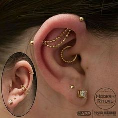 a woman wearing gold ear cuffs and piercings