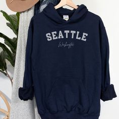 Seattle Washington Hoodie - FREE SHIPPING - Seattle Sweatshirt Cozy sweatshirt is made from a great 50/50 cotton and polyester blend - it feels so soft, plush and warm! Great for last minute gifts and fans of all things comfortable! Please see our size chart and colors (available colors and sizes may vary, please reach us to find out currently available colors and sizes). With good care, this shirt will last ages and ages and always feel soft.  Please let us know if you have any question before Seattle Sweatshirt, Seattle Washington, Cozy Sweatshirts, Best Christmas Gifts, Pacific Northwest, North West, 50 50, Soft Plush, Sweat Shirt