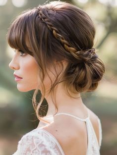 a woman with a braid in her hair looking off to the side, wearing a white dress