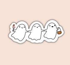 three ghost stickers are lined up in a row on a light pink background, one is holding a flower