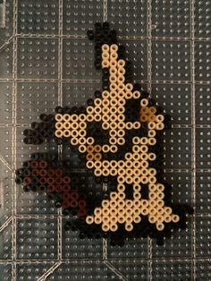 an image of a person made out of beads