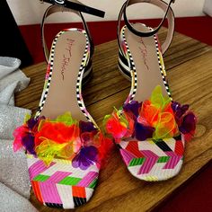 Elevate Your Summer Style With The Kove Sandal By Betsey Johnson. Featuring Vibrant Floral Appliques On A Chic Lucite Strap And A Striped Block Heel, These Sandals Are Perfect For Making A Statement. The Faux Leather Upper And Adjustable Ankle Strap Ensure A Secure And Comfortable Fit, While The Lightly Padded Footbed Keeps You Cushioned All Day Long. With A 2½" Covered Block Heel And A Rubber Sole, These Sandals Offer Both Flair And Functionality. Imported From A Smoke And Pet-Free Home, They'r Spring Multicolor Heels, Black Fabric Sandals For Spring, Chic Multicolor Spring Sandals, Fabric Heels For Spring Parties, Black Fabric Heels For Summer, Spring Fabric Heels, Multicolor Flat Heel Heels For Spring, White Fabric Heels For Party, White Fabric Party Heels