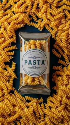 pasta in a bag on top of a pile of yellow spirals with the word pasta printed on it