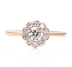 a rose cut diamond ring on a white background