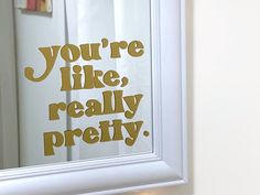 a bathroom mirror with the words you're like, really pretty on it