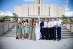 a group of people standing in front of a building