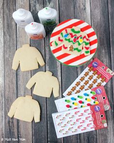 some cut out cookies sitting on top of a wooden table