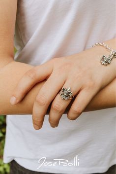 Two waves create this beautiful fleur de lis. · Sterling silver · Water lily 3/4"L x 5/8"W · Made in New Orleans Water Lily Ring, Lily Ring, Silver Water, Water Lily, Sterling Ring, New Orleans, Sterling Silver Rings, Lily, Sterling Silver