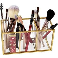 the makeup brush holder is filled with various brushes