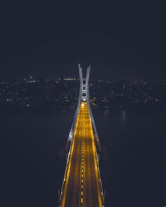 an aerial view of a bridge at night