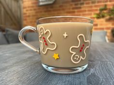 there is a glass cup that has some cookies on it and stars in the middle