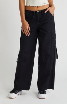 Set out on the adventure of the day in these drawcord-toggle pants made from breathable cotton and fashioned with D-ring-cinched cargo pockets for essentials. 31" inseam; 23" leg opening; 11" front rise; 15 1/2" back rise (size Medium) Zip fly with snap closure Drawcord-toggle waist Cargo flap-patch pockets with buckle closure 100% cotton Machine wash, line dry Imported Utility Pants With Cargo Pockets For Travel, Utility Cargo Pants For Travel, Cotton Utility Cargo Pants With Functional Drawstring, Cotton Cargo Pants, Rollerball Perfume, Curly Hair Care, Fragrance Design, Nordstrom Store, Fabric Gifts