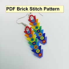 a pair of colorful beaded earrings on a white background with the words, brick stitch pattern