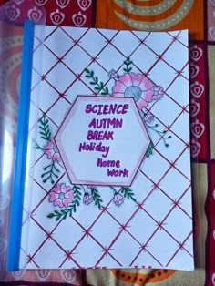 an open book with the words science autumn break holiday before work written in pink and green