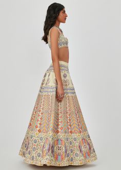 Beige kasab satin multicolor printed lehenga and blouse with heavy embellishment. Semi-stitched Digital Print Choli For Wedding, Bohemian Designer Lehenga With Printed Motifs, Festive Lehenga With Printed Motifs In Traditional Drape, Saree Sets With Printed Motifs For Reception, Reception Silk Set With Multicolor Embroidery, Floor-length Silk Sets With Printed Motifs, Designer Bohemian Lehenga With Multicolor Embroidery, Bohemian Multicolor Embroidered Lehenga For Designer Wear, Designer Multicolor Embroidered Bohemian Lehenga