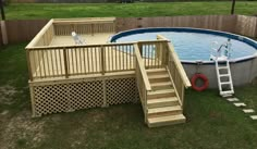 an above ground swimming pool with steps leading up to the deck and stairs down to it