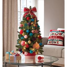 a decorated christmas tree in a living room