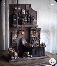 an old fashioned desk with books on it and a staircase in the backround