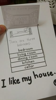 someone is holding up a piece of paper that says, i like my house there are three bedroom living room dining room kitchen cellar