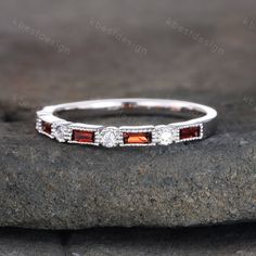 This is a unique vintage Garnet and CZ ring in 925 sterling silver. This ring is marked S925 I accept custom making order.Please contact me if you need this service. All the jewelry in my store is handmade.It may take 2-3 weeks to finish. I accept custom making order.Please contact me if you need this service. This ring is closed ring.If you want a matching band,you can ask me custom make it. For all the jewelries,there is a 14 days money back guarantee.You can return it in the time frame withou Silver Baguette Cut Half Eternity Ring, Cubic Zirconia Multi-stone Stackable Rings For Anniversary, Anniversary Multi-stone Stackable Rings In Cubic Zirconia, Anniversary Multi-stone Cubic Zirconia Stackable Rings, Anniversary Cubic Zirconia Stackable Rings With Multi-stone, Silver Eternity Band With Gemstones, Formal Silver Gemstone Eternity Band, Classic Multi-stone Stackable Rings For Anniversary, Elegant Silver Multi-stone Stackable Rings