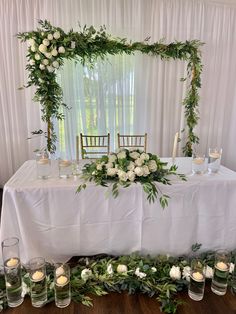 a table with candles and flowers on it