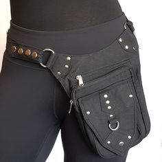 5 pocket utility hip belt in raven black with silver metal hardware. This belt converts to a shoulder bag as seen in the second photo. It has 5 pockets including 3 with zippers. Unisex design. Plenty of room for purse & phone. Be hands free on the go! Shopping, partying, at concerts and outdoor events, biking and more. Makes a super gift for a dear friend or family member. Exactly as shown in photos. What you see is what you get. In stock and ready to ship in 1-2 business days from receipt of yo Functional Black Belt Bag With Multiple Pockets, Black Belt Bag With Pockets For Festival, Leather Bound Journal, Vintage India, Hip Belt, Utility Belt, Super Gifts, Pocket Belt, Shoulder Bag Black