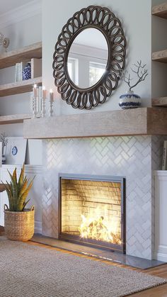 a living room with a fire place and a mirror on the wall next to it