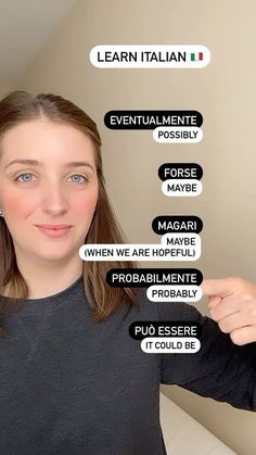 a woman is holding up her fingers to show the words in different languages on her face