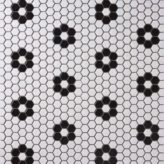 black and white hexagonal tiles are arranged in the shape of an eight - pointed star