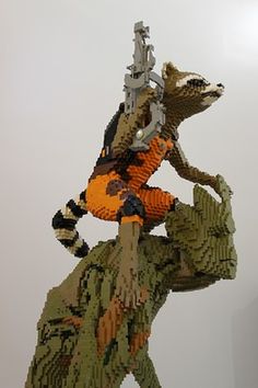 Check Out This Huge Lego Model of Groot and Rocket Raccoon for SDCC (Exclusive). (I seen this at Toronto Fan Expo this year! VERY cool!) Groot And Rocket, Rocket Groot, Lego Board, Lego Sculptures, Lego Boards, Amazing Lego Creations, Lego Worlds, Cool Lego Creations