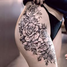 a woman's thigh with flowers on it