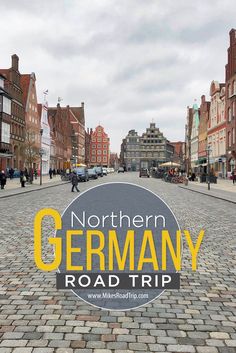 the words northern germany road trip are overlaid by an image of a cobblestone street