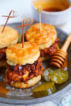 mini sandwiches with pickles and cheese on a plate