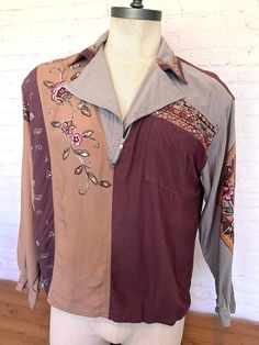 "70's long sleeve shirt Burgundy, tan and gray half zip shirt has a very unique floral design on the front, sleeve and collar. Metal zipper One front pocket One metal button at cuff Tag size Large Brand - Together! 100% Rayon Free shipping!! Measurement when laying flat across: Chest - 21.5\" Length - 26\" Sleeve - 22\"" Bohemian Collared Tops For Fall, Fall Bohemian Collared Tops, Retro Patchwork Top For Fall, Fall Retro Patchwork Top, Brown Patchwork Shirt For Fall, Fall Patchwork Retro Top, Bohemian Long Sleeve Brown Shirt, Fall Vintage Print Collared Tops, Bohemian Collared Shirt For Fall