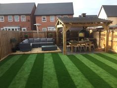 an outdoor living area with artificial grass