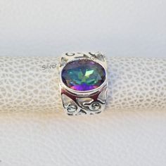 Gemstone-Mystic Topaz Shape-Oval Stone Size- 10x14 MM Metal-925 Sterling Silver This One of a kind ring is adorned with beautiful Multicolour Mystic Topaz Gemstone set in sterling silver. About gemstones-Mystic Topaz is one of a kind stone which showcase multicolour. It sparkle and amazing colors are enough reasons for anyone to be dazzled by them.This beautiful gemstone not only possess physical healing properties but also magical healing properties.Wearer of the stone can be protected from neg Mystical Iridescent Sterling Silver Rings, Mystical Sterling Silver Cabochon Ring, Mystic Topaz Earrings, Mystic Fire Topaz, Physical Healing, Mystic Topaz Ring, Mystic Topaz, Oval Stone, Silver Rings Handmade