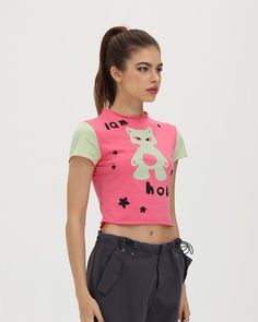 Model (WearingXS):• Height: 171cm | Bust: 83cm | Waist: 59cm | Hips: 89cmDetails: Pink T-shirt with "I am Hobby" meme graphic printTop Length: CroppedSleeve Length: Short SleevesMaterials:95% Cotton + 5% Spandex Y2k Crew Neck T-shirt With Character Print, Fitted Fun T-shirt With Text Print, Fitted Fun T-shirt With Screen Print, Green Graphic Print Y2k Tops, Y2k Green Graphic Print Tops, Green Y2k Graphic Print Tops, Y2k Green Tops For Streetwear, Y2k Green Top For Streetwear, Green Y2k Style Top For Streetwear