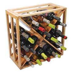 a wooden wine rack filled with bottles on top of a hard wood floor next to stairs